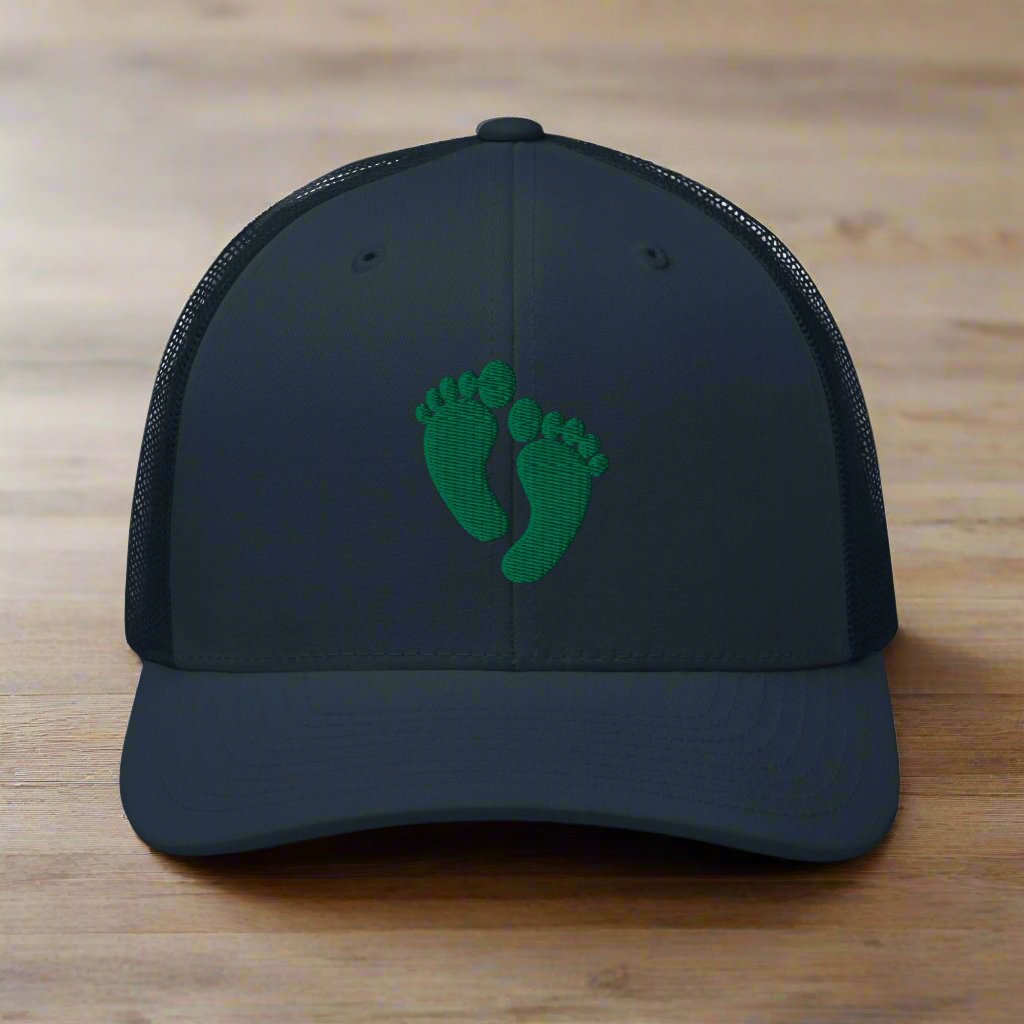 air force pararescue pj green feet embroidered on a snapback trucker hat.