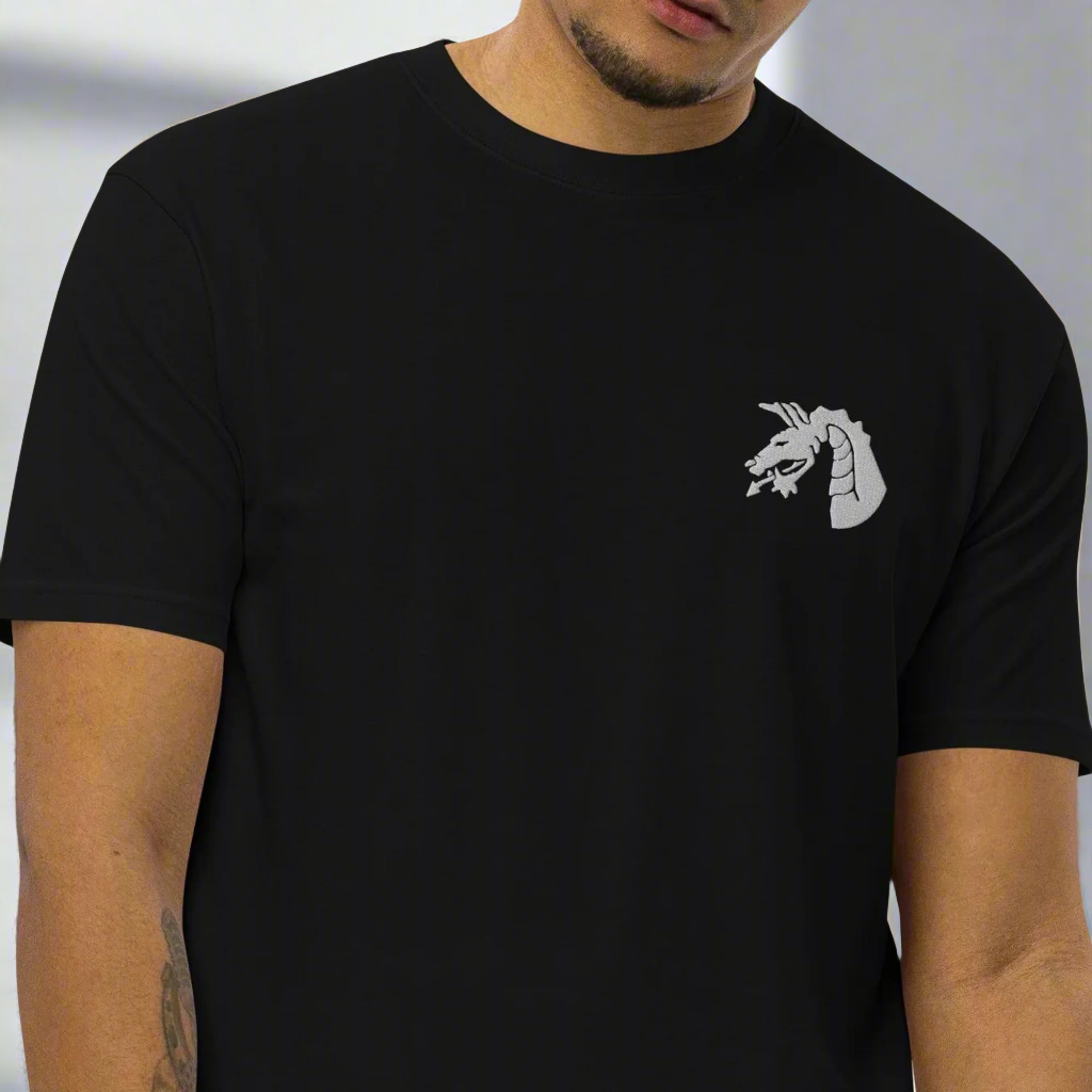 18th airborne corps dragon design embroidered on the left chest of a t-shirt.