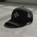 4th infantry division insignia embroidered on a snapback trucker hat