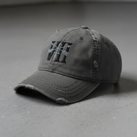 Distressed dad hat with 7th special forces group roman numeral design