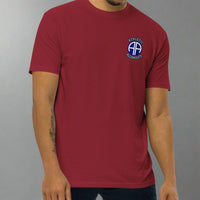 Red t-shirt with 82nd airborne insignia and the text athletic alcoholics 