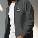 82nd airborne insignia embroidered on the left chest of a full zip hoodie.