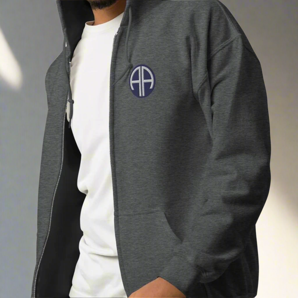 82nd airborne insignia embroidered on the left chest of a full zip hoodie.