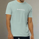 Man wearing a light blue t-shirt with the words humble sundays on the chest 
