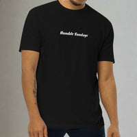 Man wearing a black t-shirt with 'Humble Sundays' text