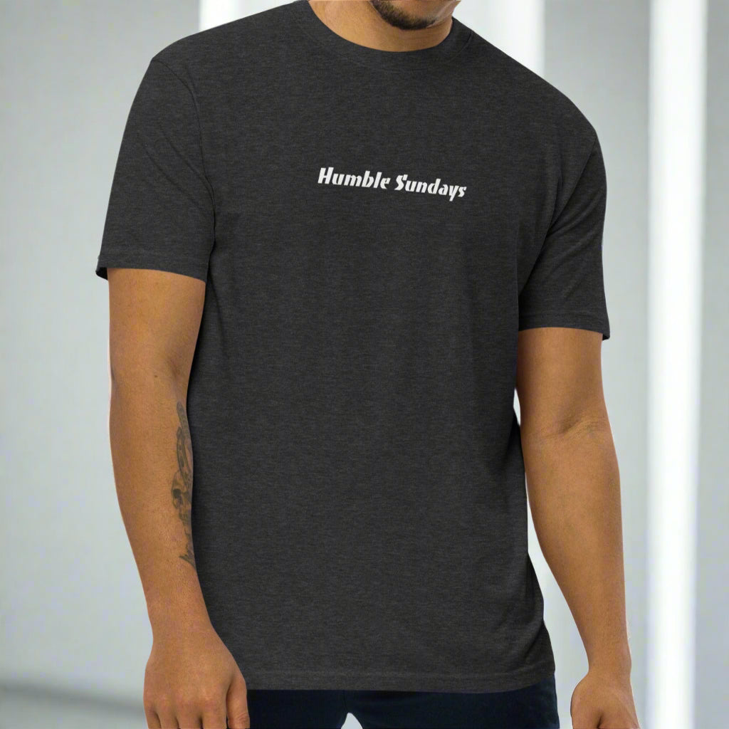 Man wearing a dark gray t-shirt with 'Humble Sundays' text