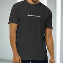 Man wearing a dark gray t-shirt with 'Humble Sundays' text