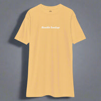 Men's gold t-shirt with the words Humble Sundays across the chest.