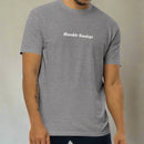 Man wearing a gray t-shirt with 'Humble Sundays' text 