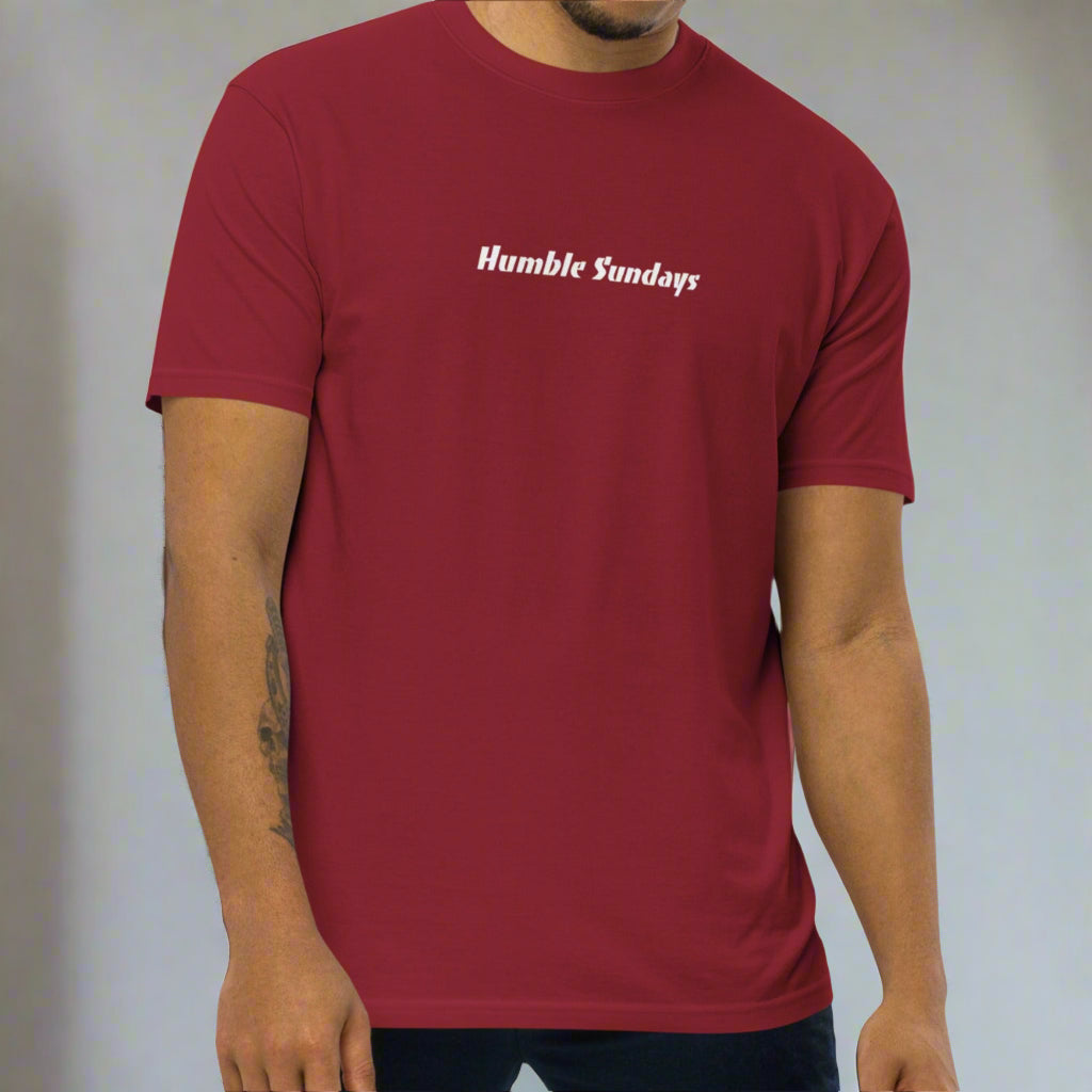 Man wearing a red t-shirt with 'Humble Sundays' 