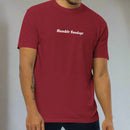 Man wearing a red t-shirt with 'Humble Sundays' 