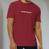 Man wearing a red t-shirt with 'Humble Sundays' 