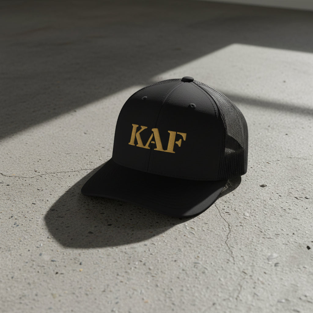 snapback trucker hat with text 'KAF' embroidered 
