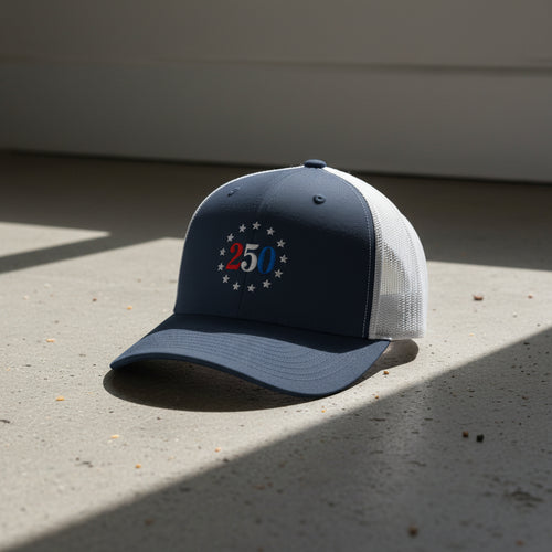 navy and white trucker hat with embroidered "250" inside a circle of stars for america 250th anniversary and 4th of july