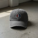 gray distressed dad hat with embroidered "250" inside a circle of stars for america 250th anniversary and 4th of july