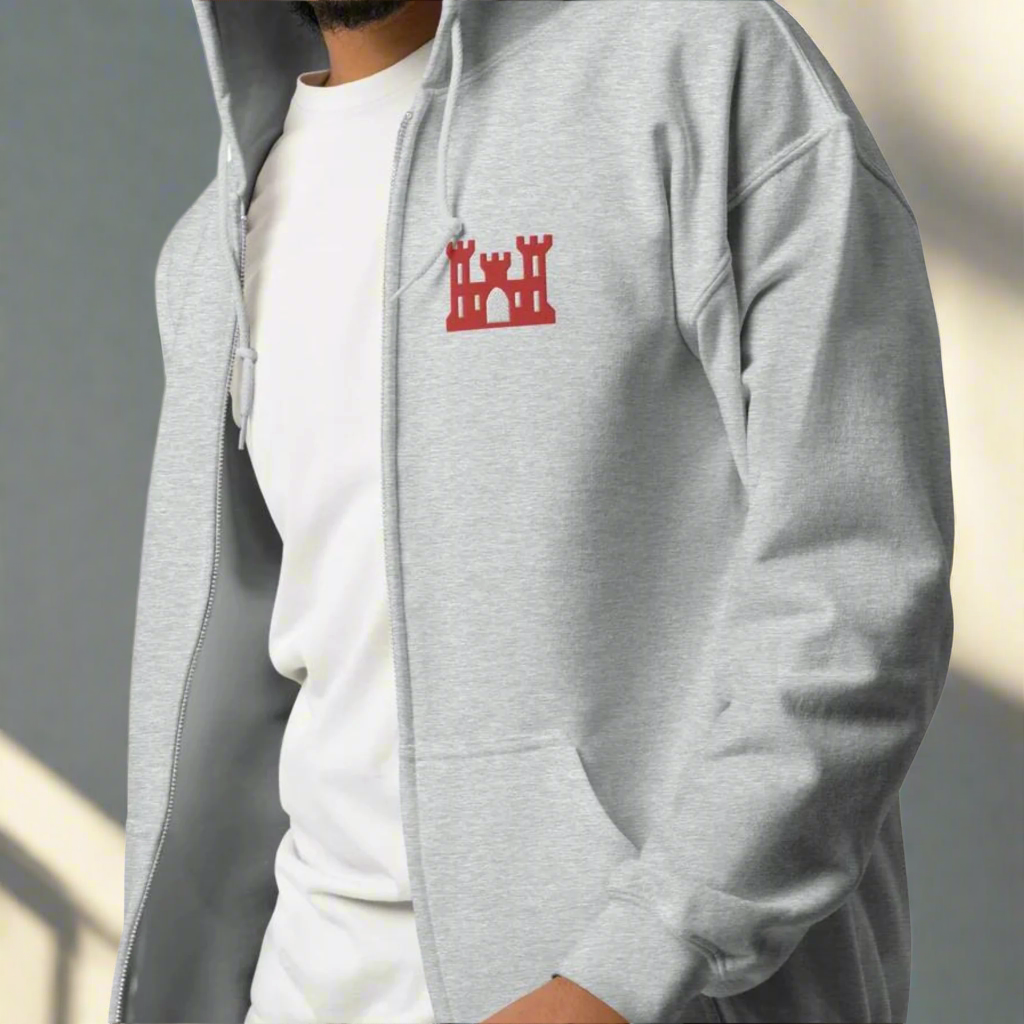 Army corps of engineers insignia embroidered design on the left chest of a full zip hoodie.