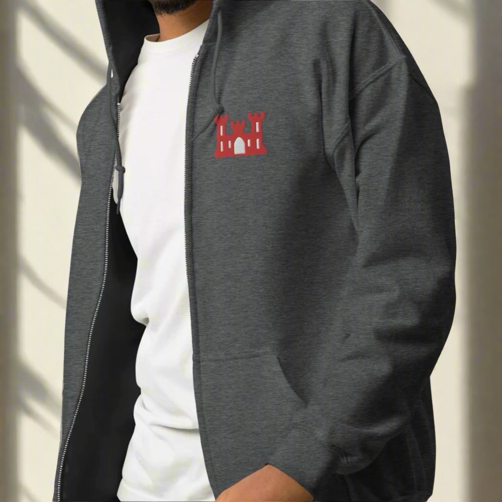 Army corps of engineers insignia embroidered design on the left chest of a full zip hoodie.