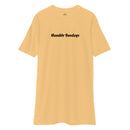 gold t-shirt with text "humble sundays" across the chest