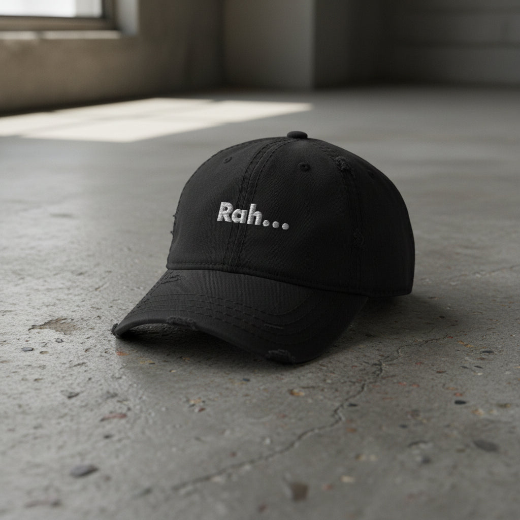 black distressed dad hat with embroidered text "Rah" 