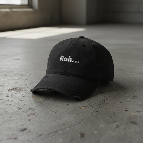 black distressed dad hat with embroidered text "Rah" 