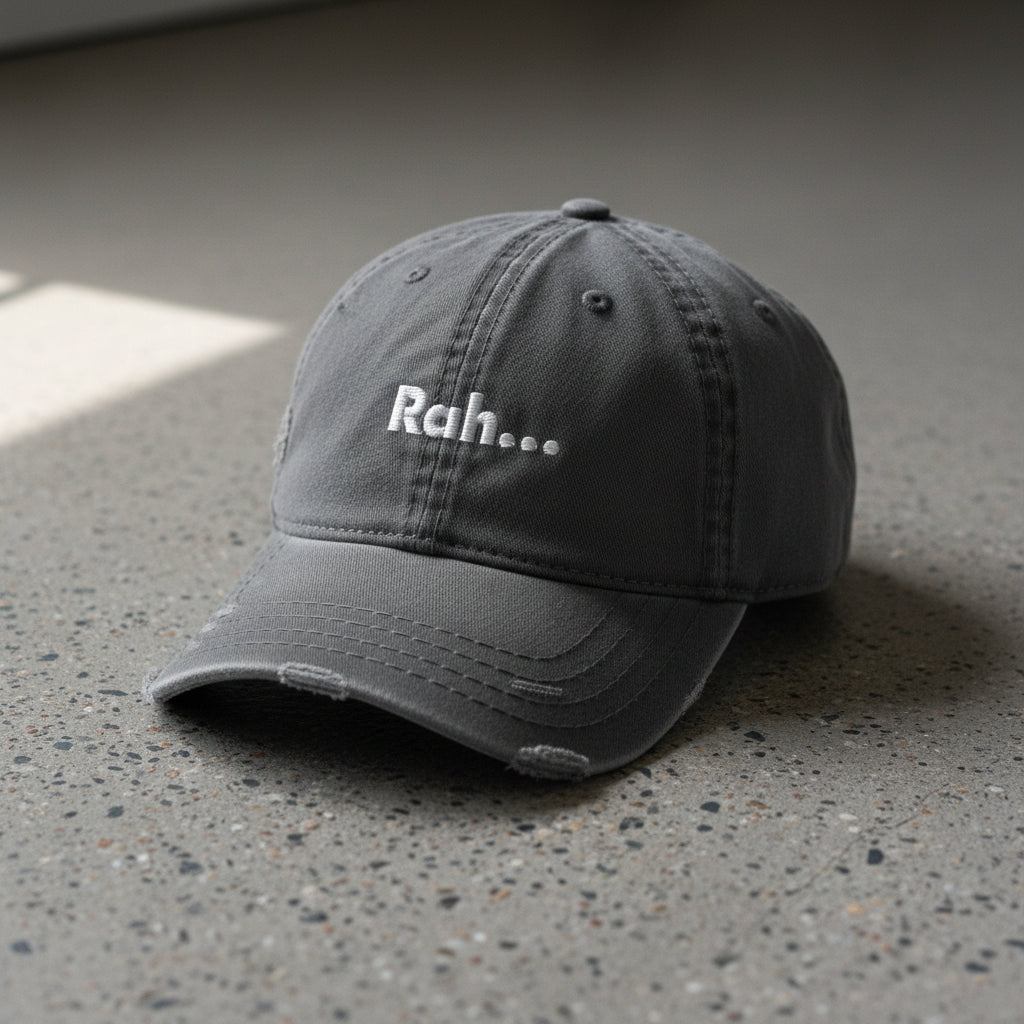 gray distressed dad hat with embroidered text "Rah" 