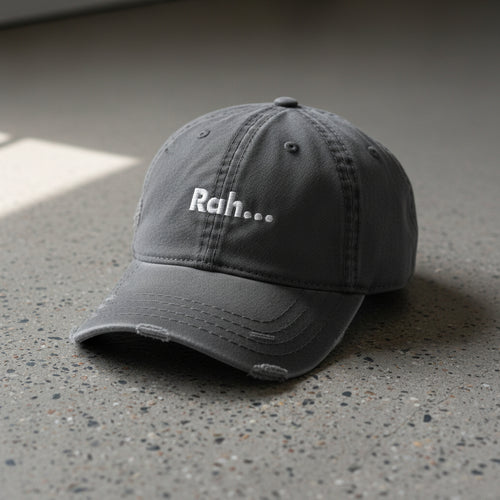 gray distressed dad hat with embroidered text "Rah" 
