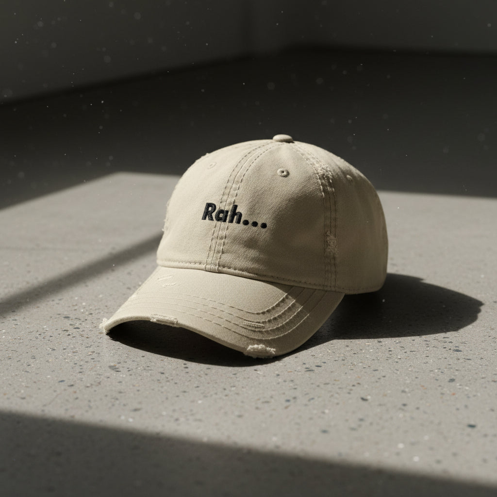 khaki distressed dad hat with embroidered text "Rah" 