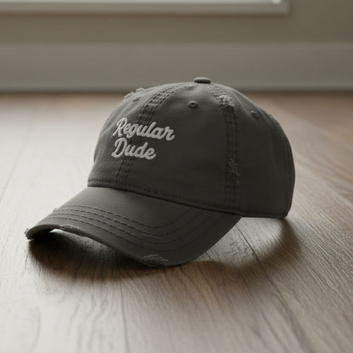 grey distressed dad hat embroidered with the words regular dude