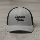 gray snapback cap with embroidered 'Regular Dude' text 