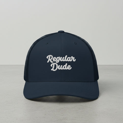 navy snapback cap with embroidered 'Regular Dude' text 