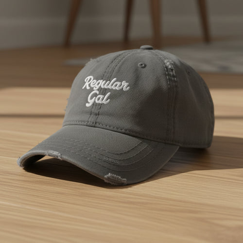 charcoal distressed dad hat embroidered with the words regular gal