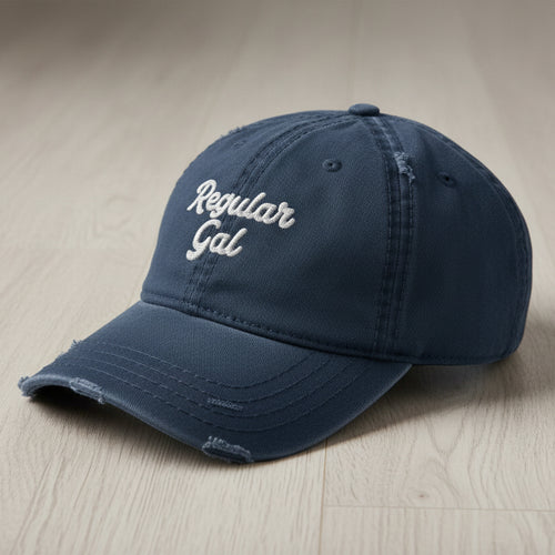 navy distressed dad hat embroidered with the words regular gal