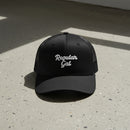 black snapback cap with embroidered 'Regular Gal' text 