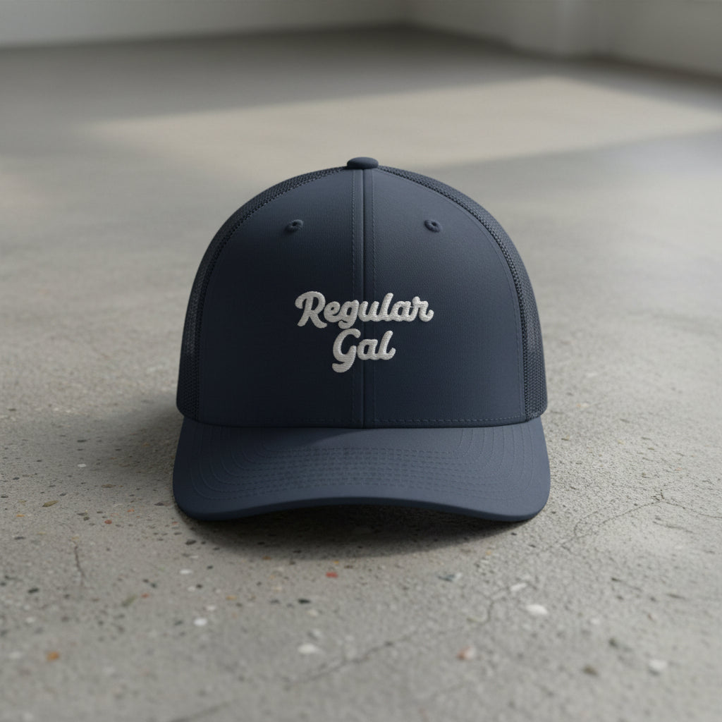 navy snapback cap with embroidered 'Regular Gal' text 