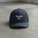 navy snapback cap with embroidered 'Regular Gal' text 