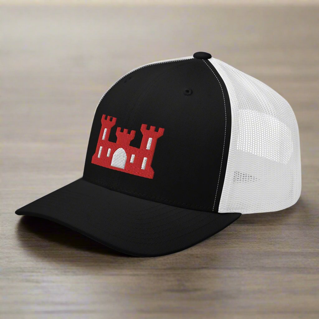 Army corps of engineers insignia on a snapback trucker hat.