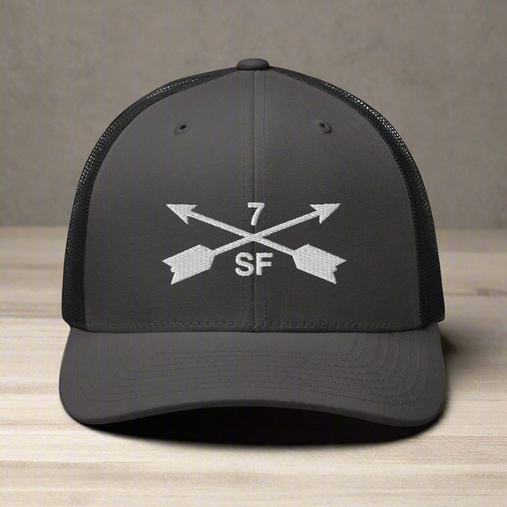 7th special forces group embroidered trucker hat. Embroidery design of two crossed arrows with a 7 above and SF below.