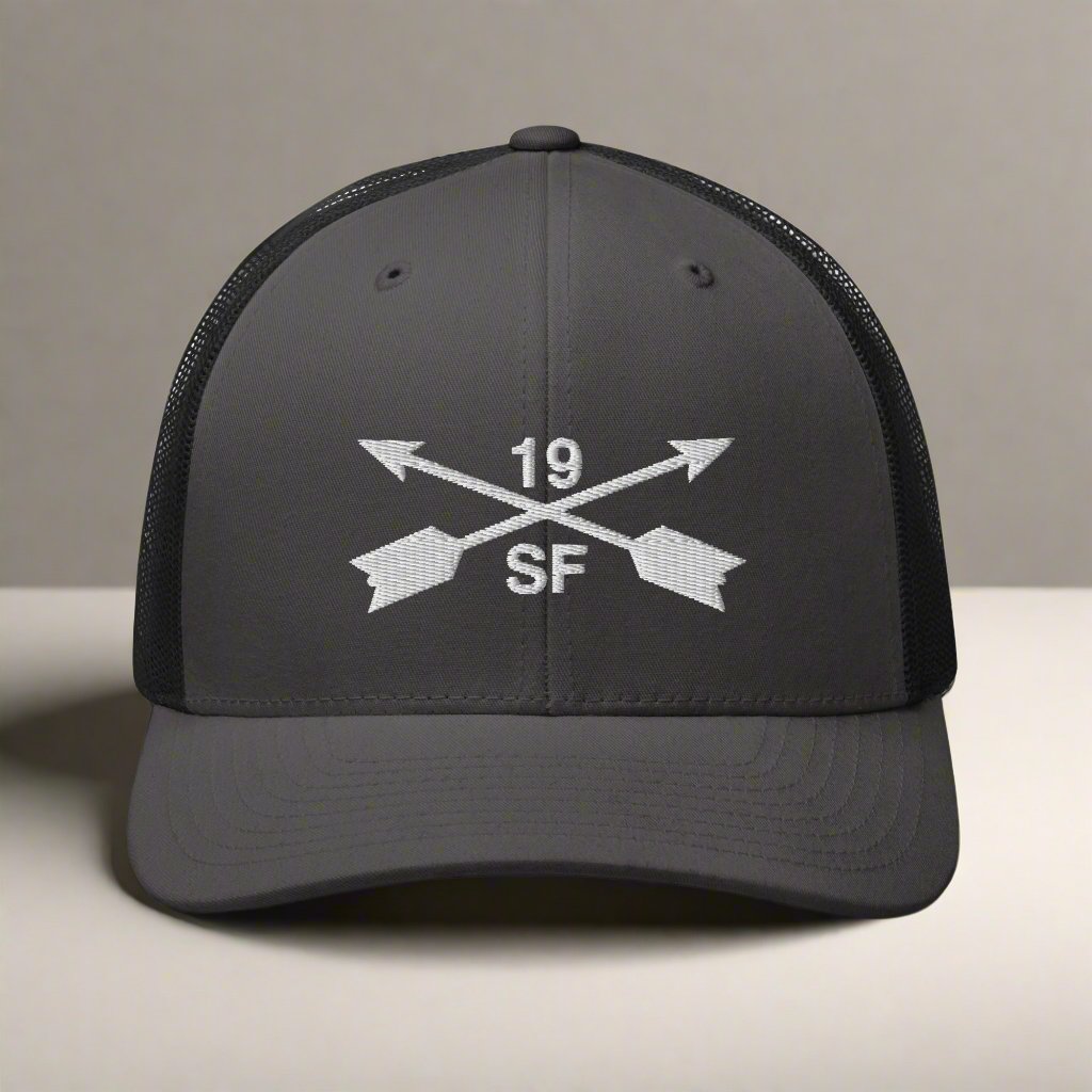 19th special forces group embroidered trucker hat. Embroidery design of two crossed arrows with a 19 above and SF below.