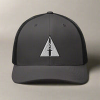 Embroidered delta force insignia on a snapback trucker hat.