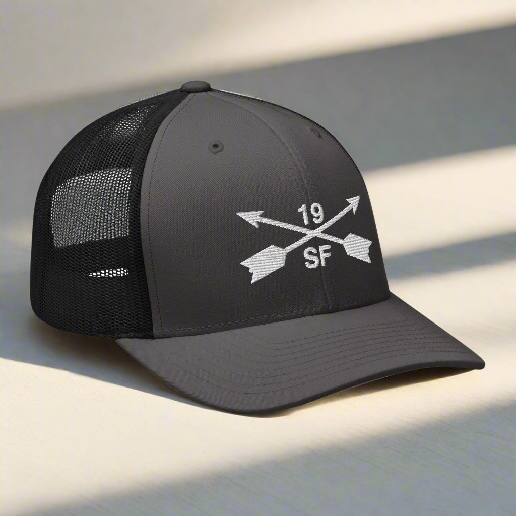 19th special forces group embroidered trucker hat. Embroidery design of two crossed arrows with a 19 above and SF below.