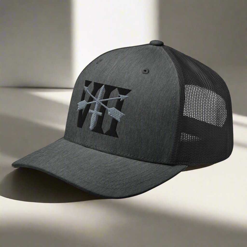 Snapback trucker hat embroidered with 7th special forces group roman numeral design