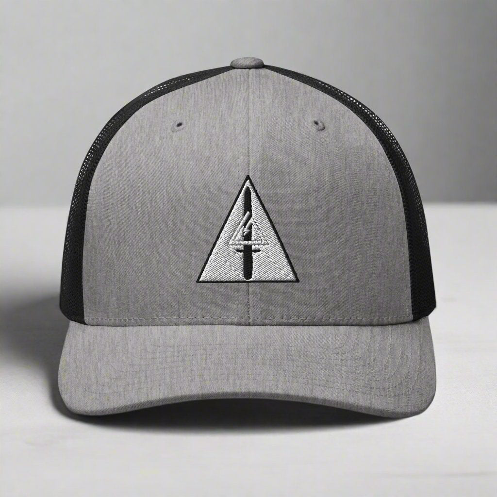 Embroidered delta force insignia on a snapback trucker hat.