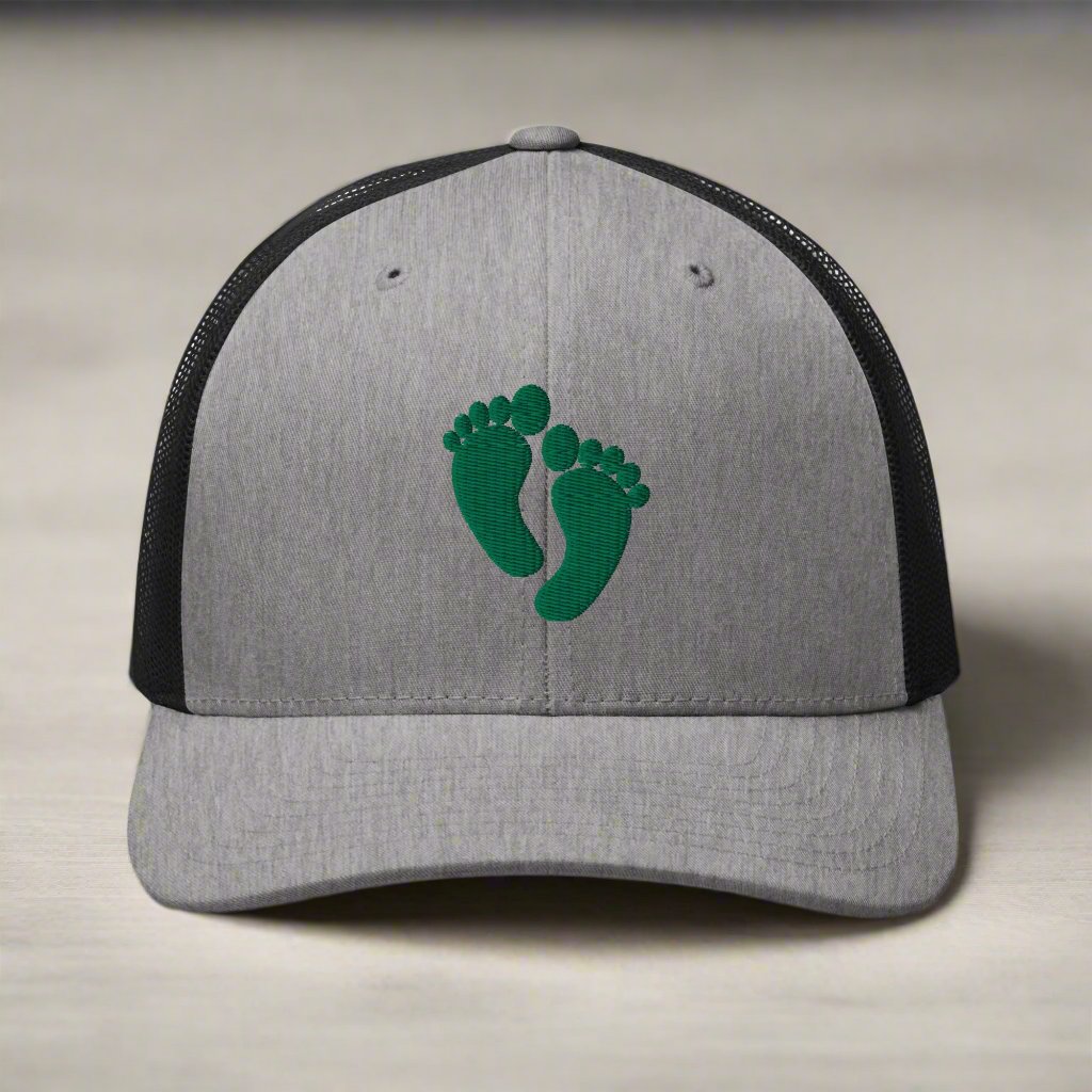 air force pararescue pj green feet embroidered on a snapback trucker hat.