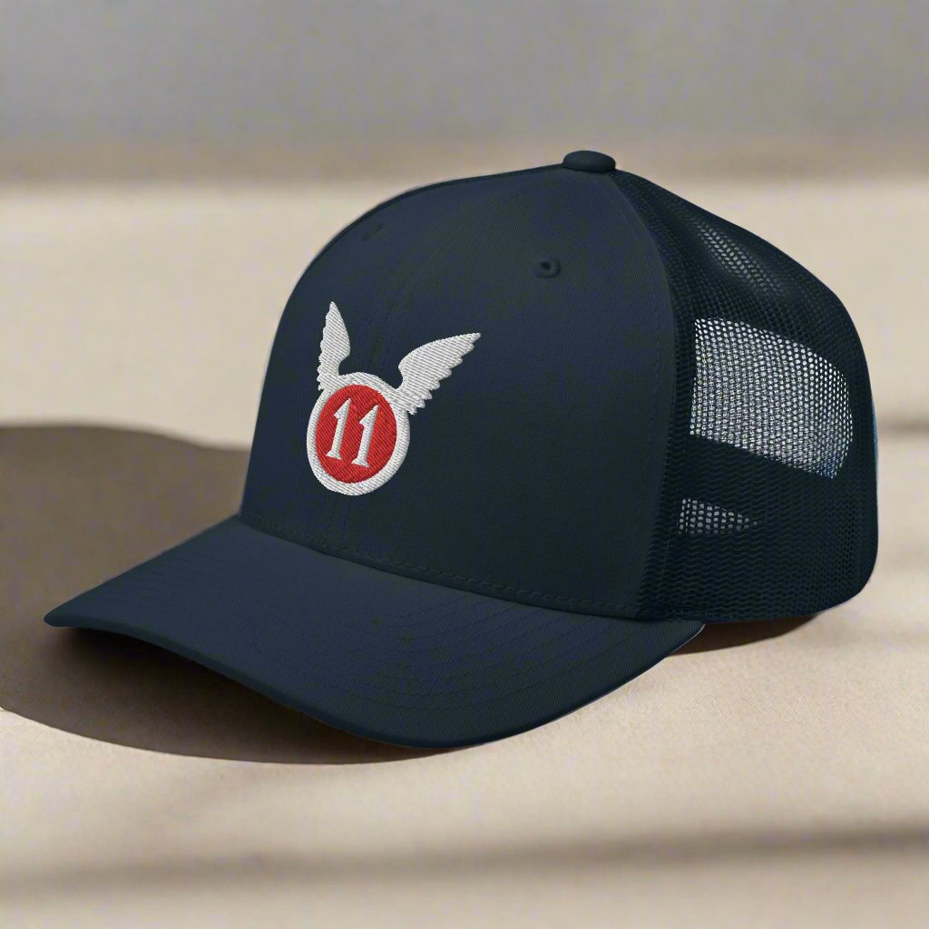 snapback trucker hat embroidered with the 11th airborne insignia.