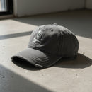 distressed dad hat with skull and crossbones logo