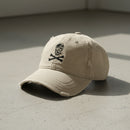 distressed dad hat with skull and crossbones logo