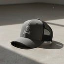 charcoal trucker hat with skull and crossbones