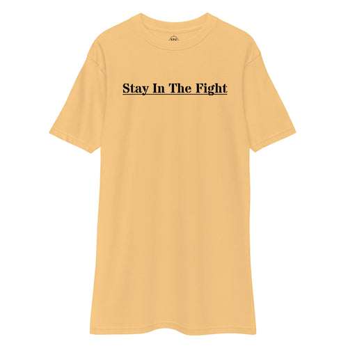 gold t-shirt with the text "stay in the fight" across the chest