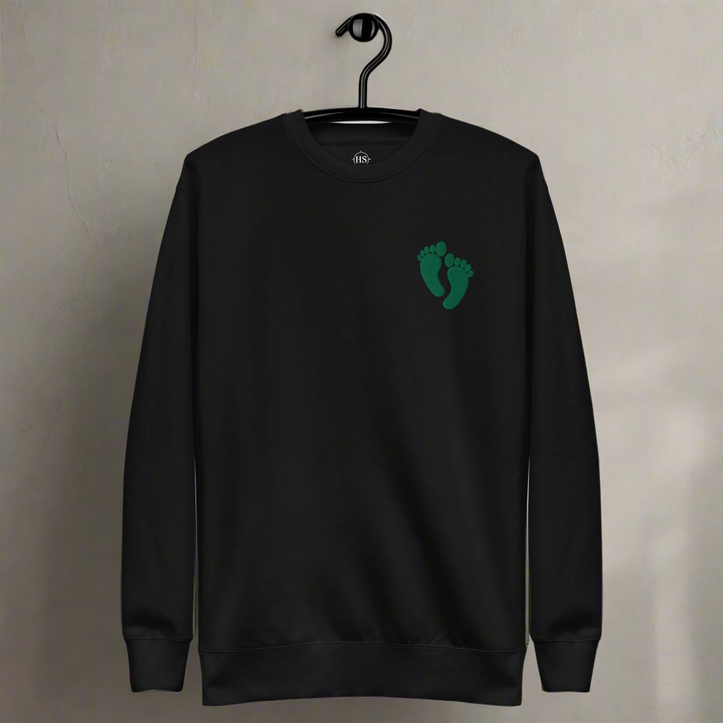 PJ green feet embroidered on a sweatshirt