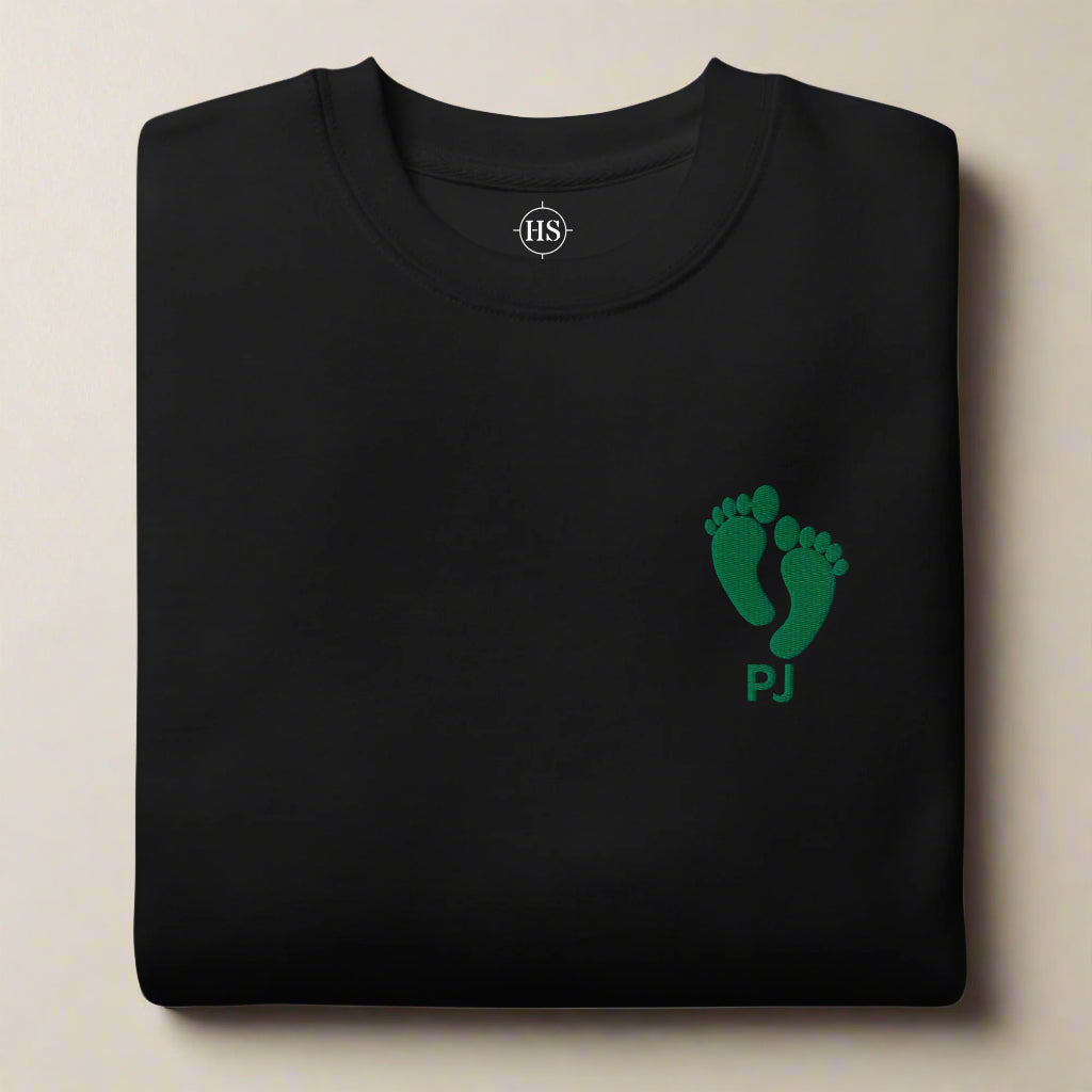 sweatshirt embroidered with pj green feet and the word PJ on the left chest
